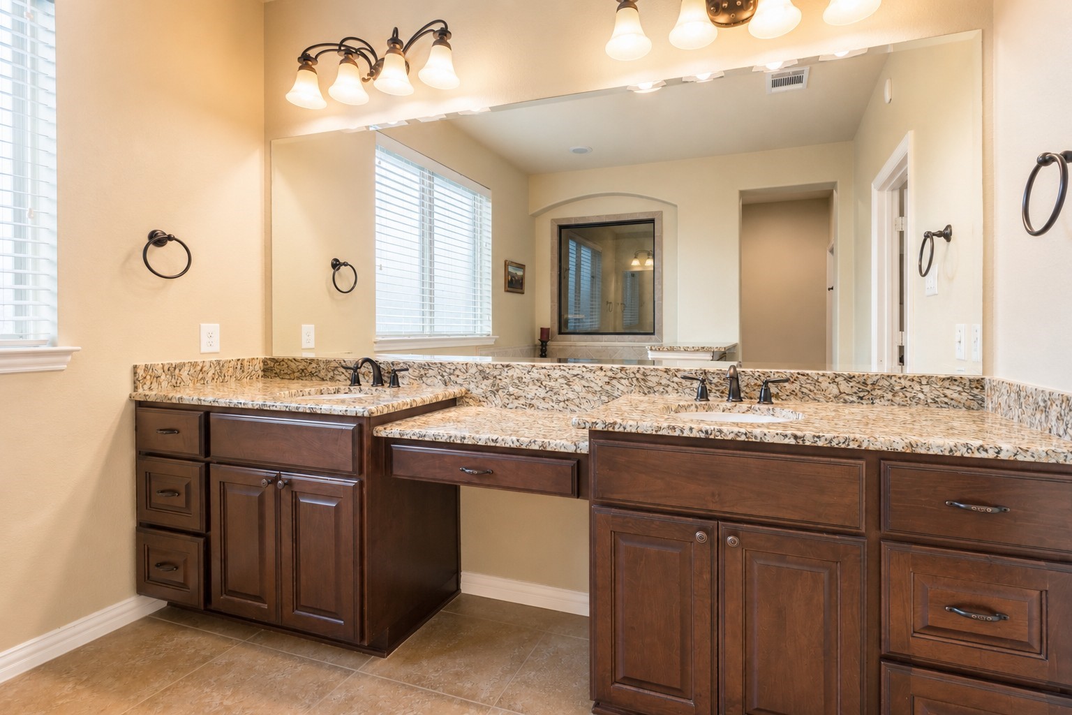 2326 Hamilton Pool Lane Friendswood, TX 77546 - Photo 22 of 49 a bathroom with a granite countertop sink and a mirror