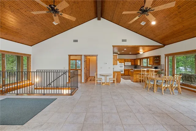 a lobby with furniture and a ceiling fan