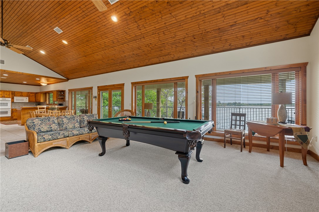 10959 Clyde Acord Road Franklin, TX 77856 - Photo 15 of 44 a living room with furniture pool table table and a couch