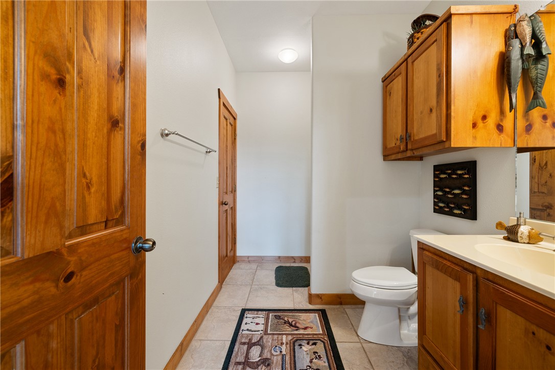 10959 Clyde Acord Road Franklin, TX 77856 - Photo 23 of 44 a bathroom with a sink a toilet and shower