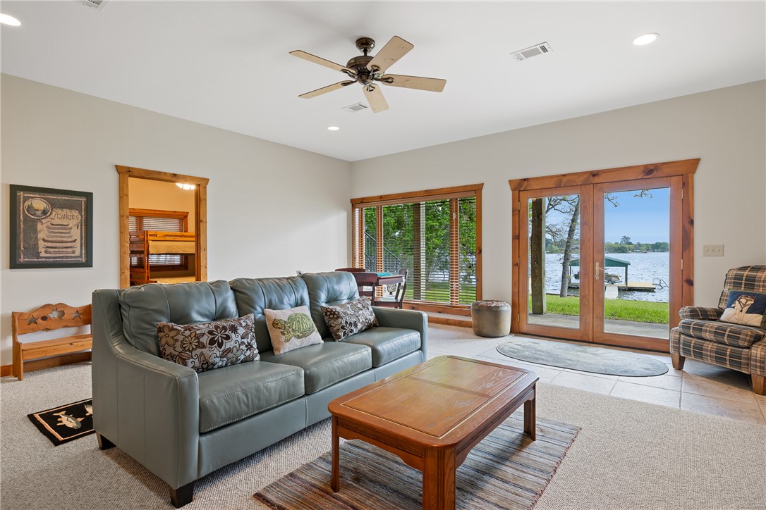 10959 Clyde Acord Road Franklin, TX 77856 - Photo 25 of 44 a living room with furniture and a large window