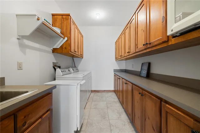 a kitchen with stainless steel appliances granite countertop a sink and dishwasher a stove top oven with wooden floor