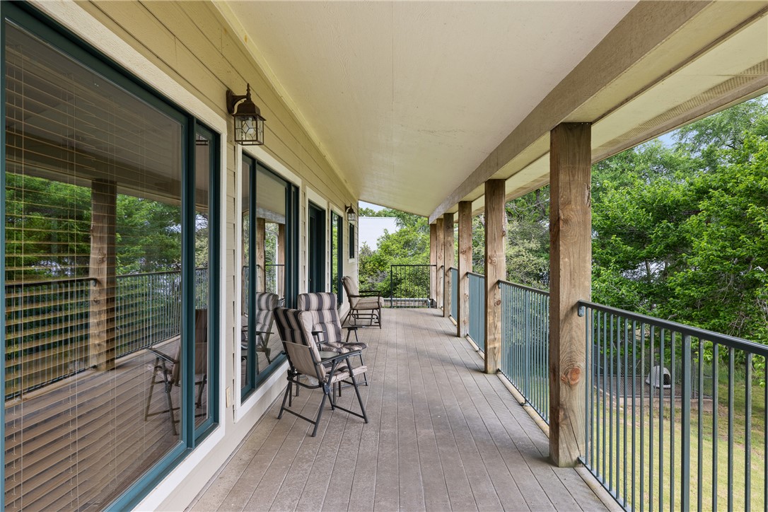 10959 Clyde Acord Road Franklin, TX 77856 - Photo 31 of 44 a view of a porch with chairs and backyard