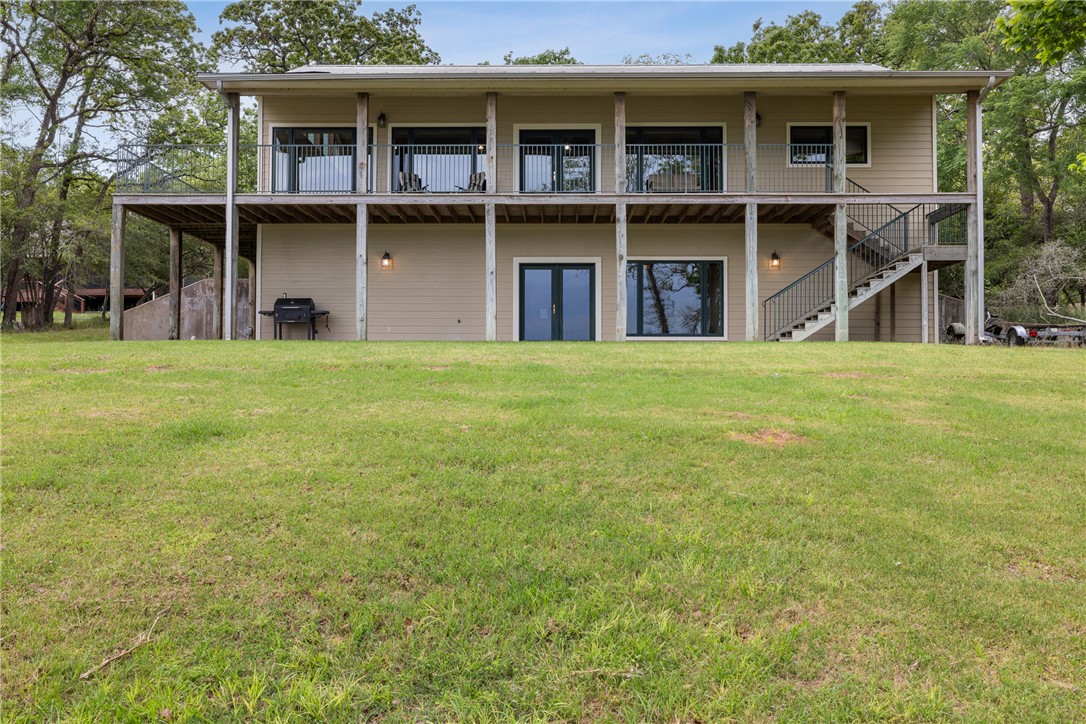 10959 Clyde Acord Road Franklin, TX 77856 - Photo 32 of 44 a front view of a house with a yard