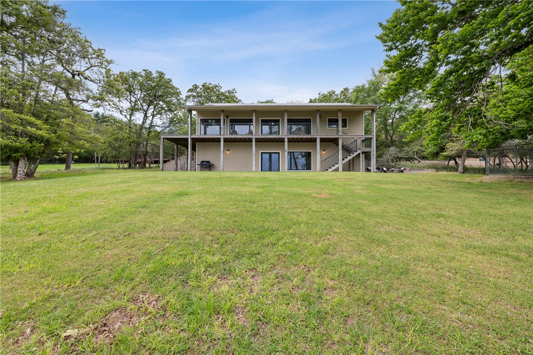 10959 Clyde Acord Road Franklin, TX 77856 - Photo 5 of 44 a view of a big room with a big yard and large trees