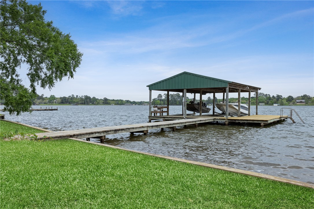 10959 Clyde Acord Road Franklin, TX 77856 - Photo 6 of 44 a backyard of a house with lots of green space and fountain