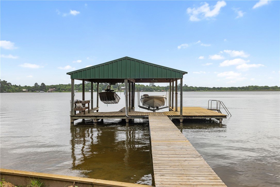 10959 Clyde Acord Road Franklin, TX 77856 - Photo 7 of 44 a view of a lake with house and outdoor space