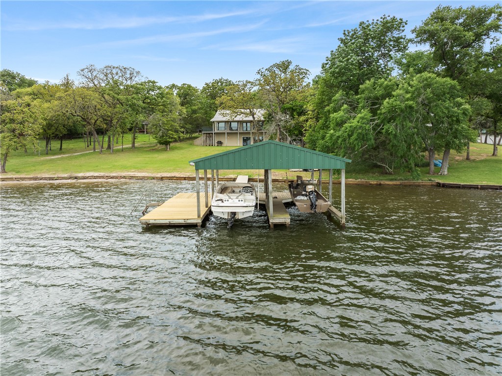 10959 Clyde Acord Road Franklin, TX 77856 - Photo 9 of 44 a view of a lake with a mountain