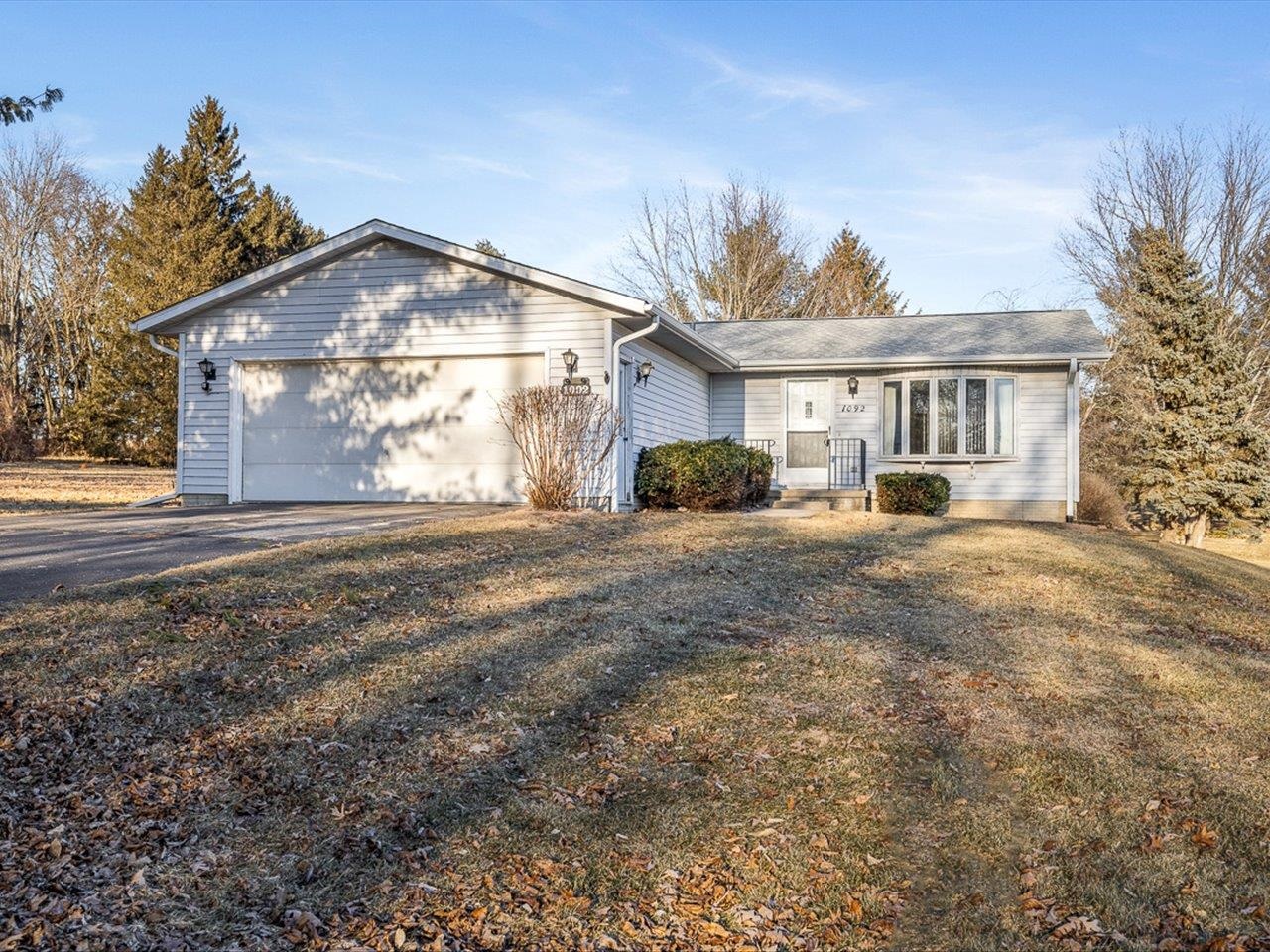 1092 Winborne Road Lake Summerset, IL 61019 - Photo 1 of 34 a front view of a house with a yard and garage