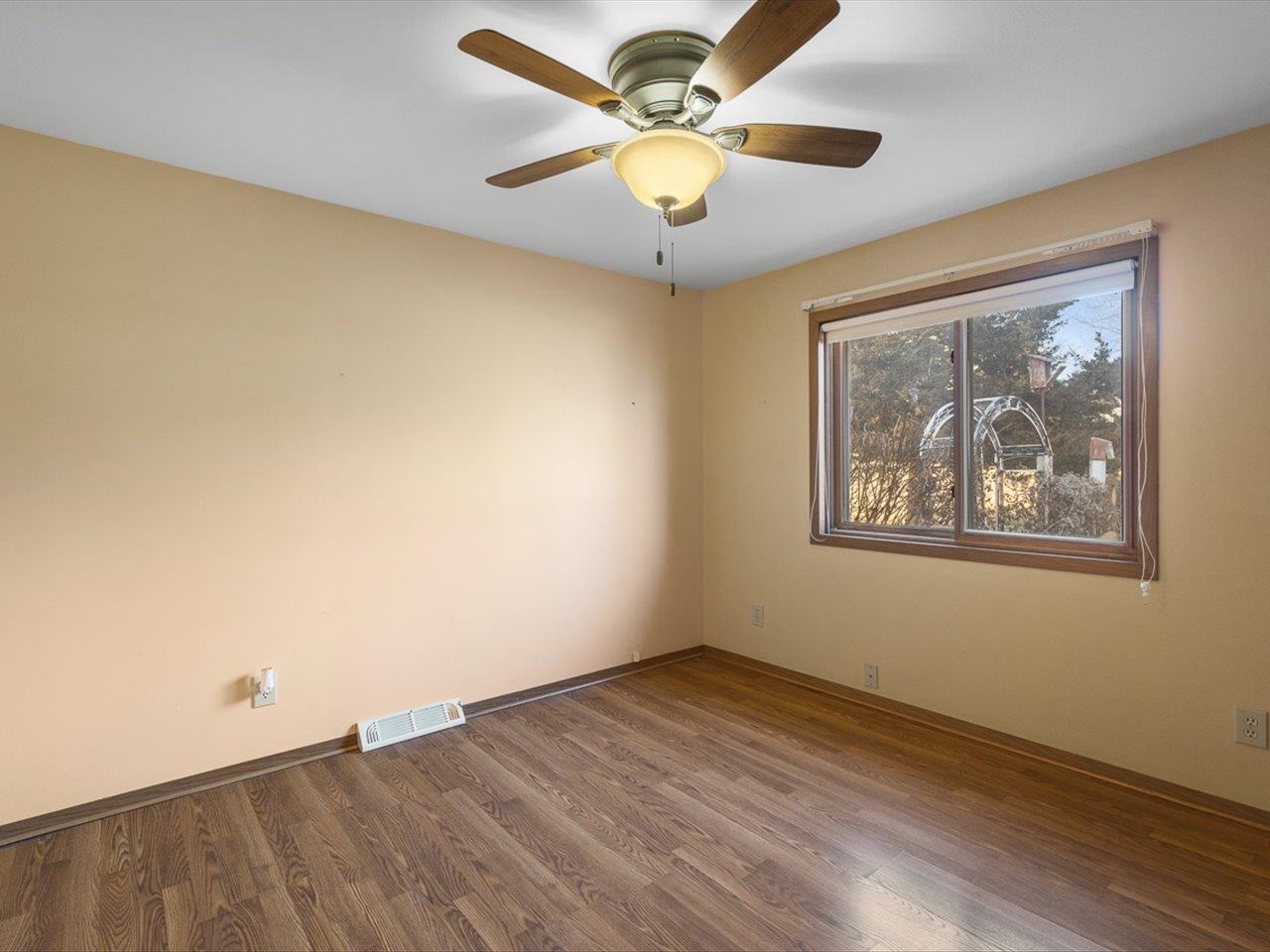 1092 Winborne Road Lake Summerset, IL 61019 - Photo 15 of 34 an empty room with a window and a ceiling fan