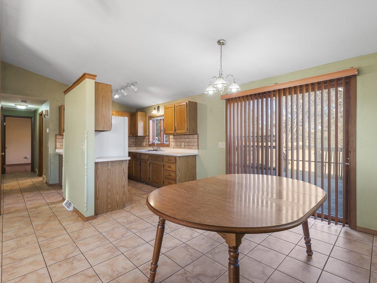 1092 Winborne Road Lake Summerset, IL 61019 - Photo 5 of 34 a view of a kitchen with furniture and refrigerator