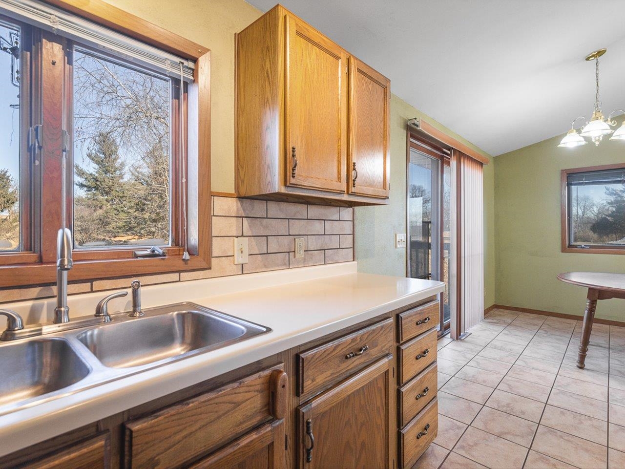 1092 Winborne Road Lake Summerset, IL 61019 - Photo 9 of 34 a kitchen with a sink cabinets and a large window