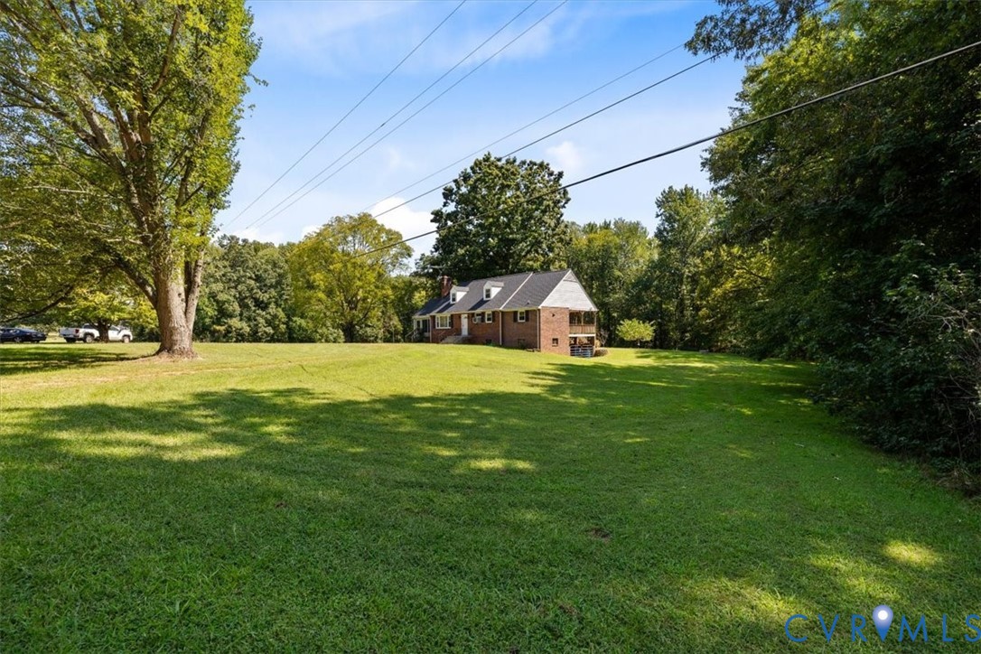 3577 Old Buckingham Road Powhatan, VA 23139 - Photo 12 of 36 Expansive grassy area with mature trees and a bric