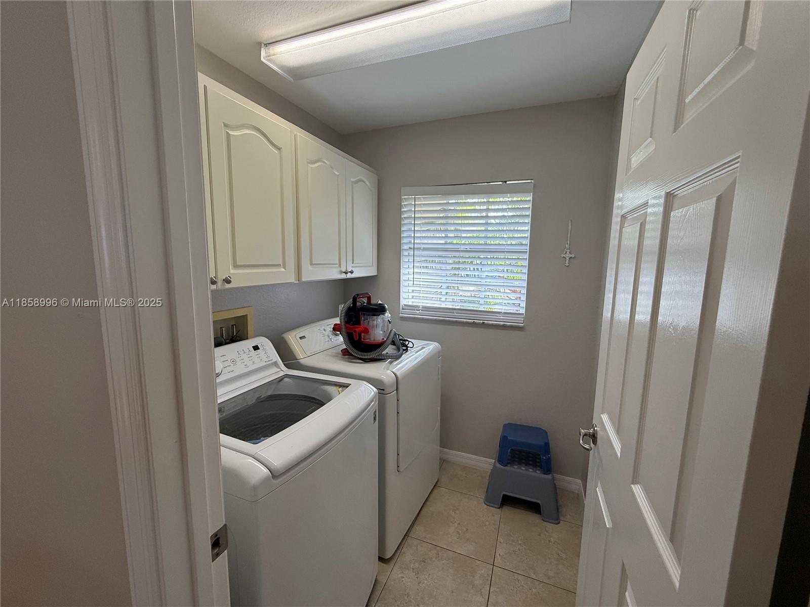 4115 Hammock Road Sebring, FL 33875 - Photo 14 of 25 a room with storage and utility