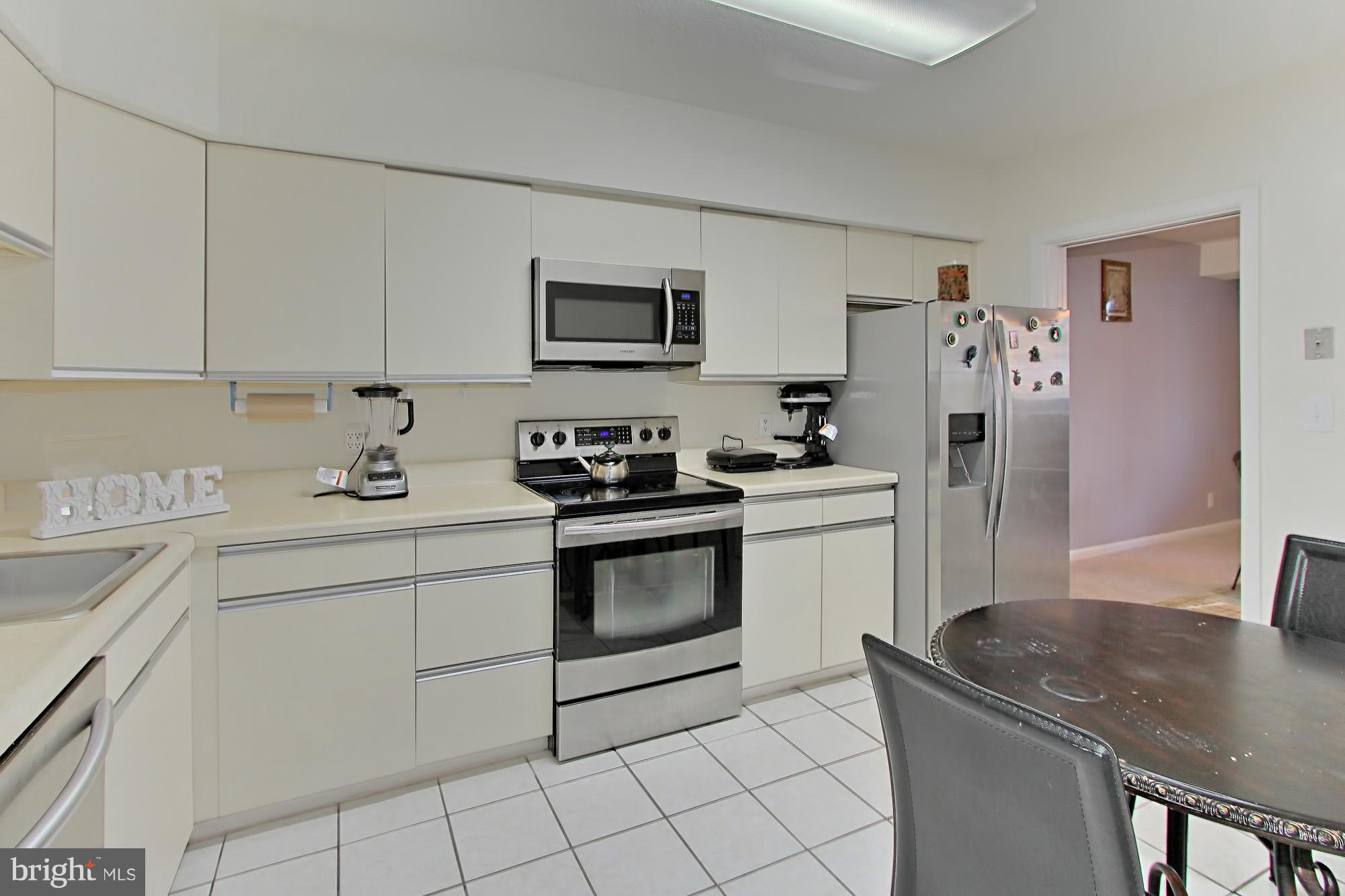 5501 Seminary Road, Unit 314S Falls Church, VA 22041 - Photo 1 of 30 a kitchen with stainless steel appliances granite countertop a sink stove refrigerator and white cabinets