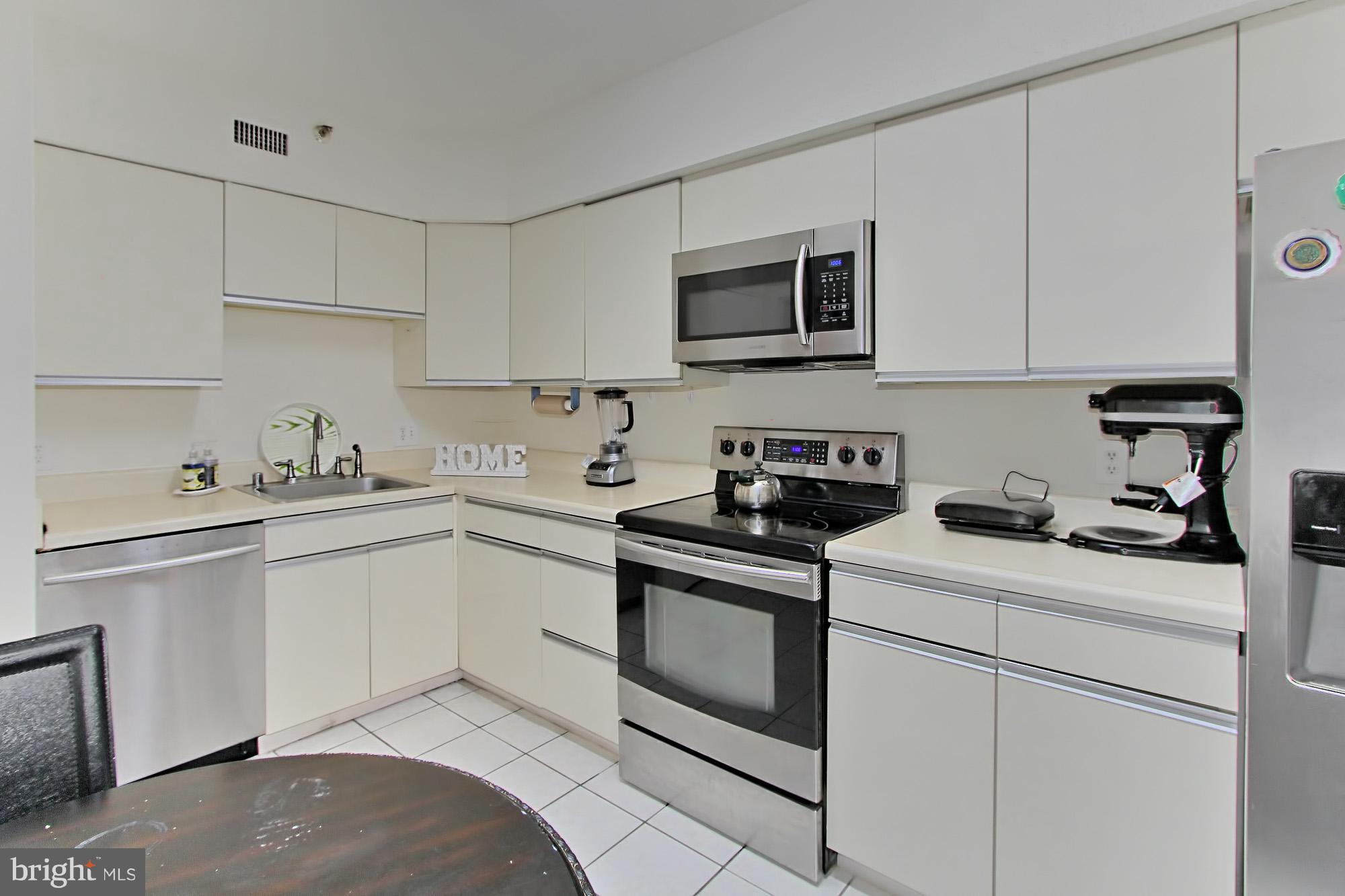 5501 Seminary Road, Unit 314S Falls Church, VA 22041 - Photo 2 of 30 a kitchen with cabinets appliances a sink and a counter top