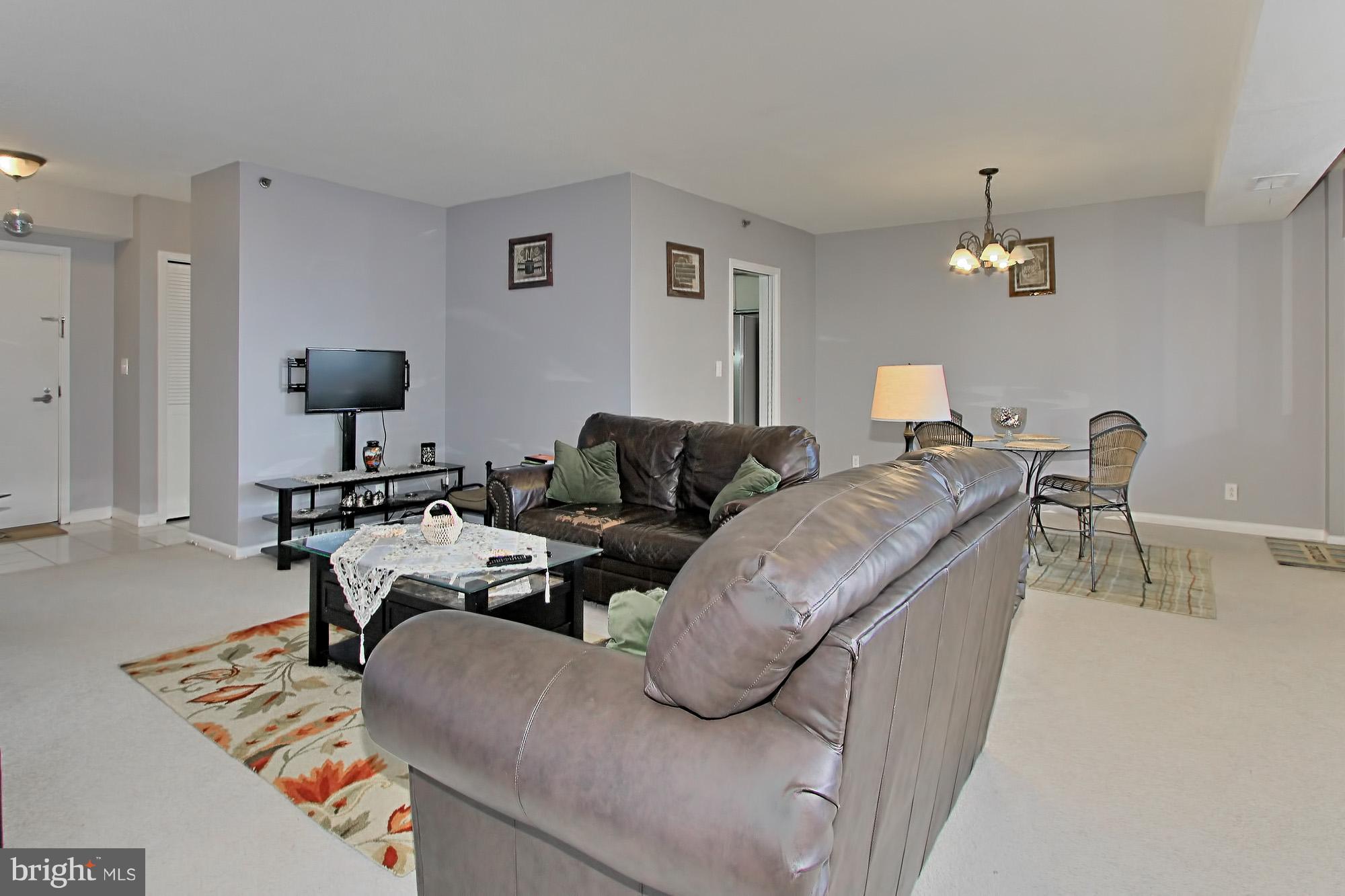 5501 Seminary Road, Unit 314S Falls Church, VA 22041 - Photo 13 of 30 a living room with furniture and a chandelier