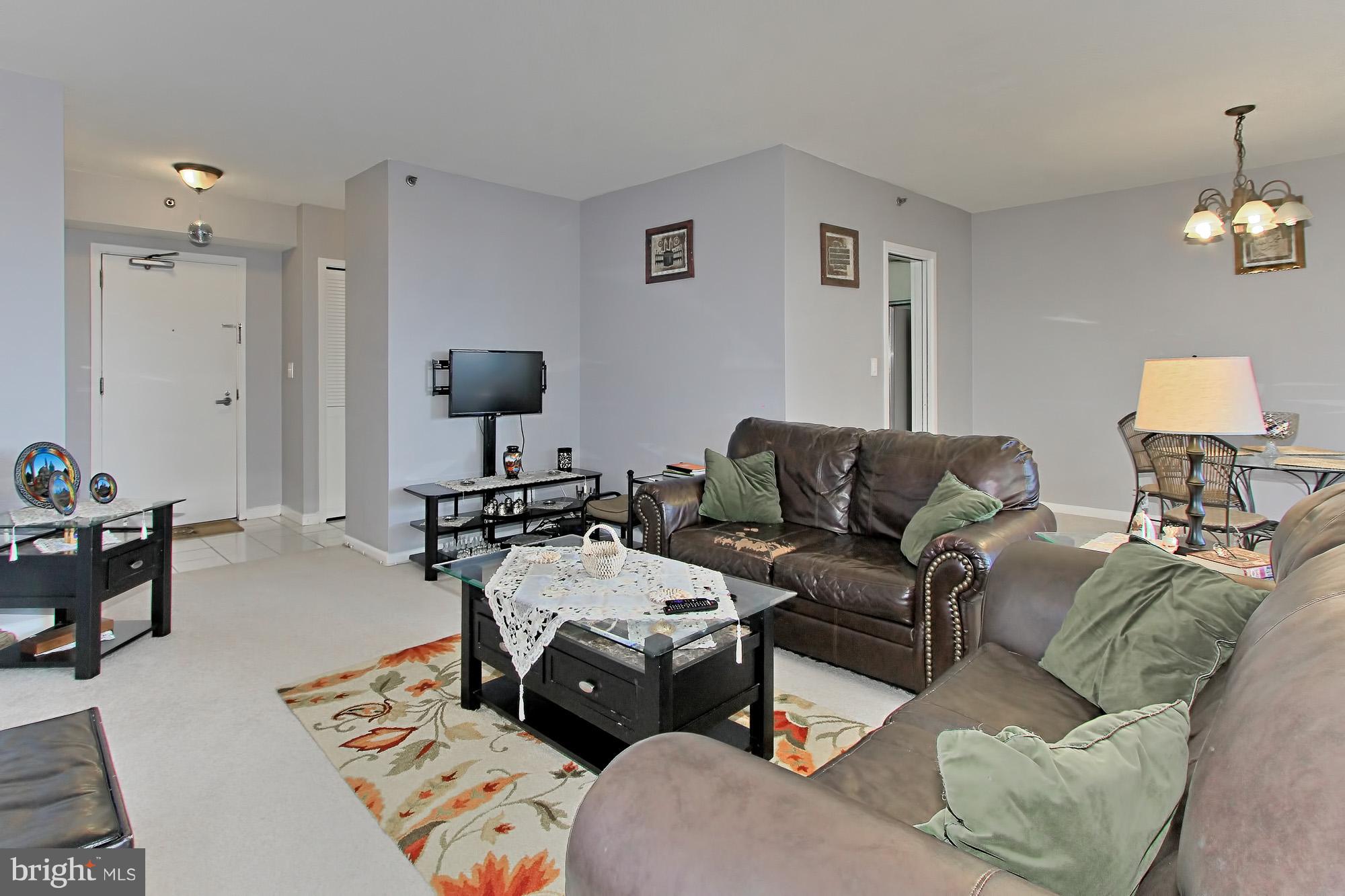 5501 Seminary Road, Unit 314S Falls Church, VA 22041 - Photo 14 of 30 a living room with furniture and a chandelier