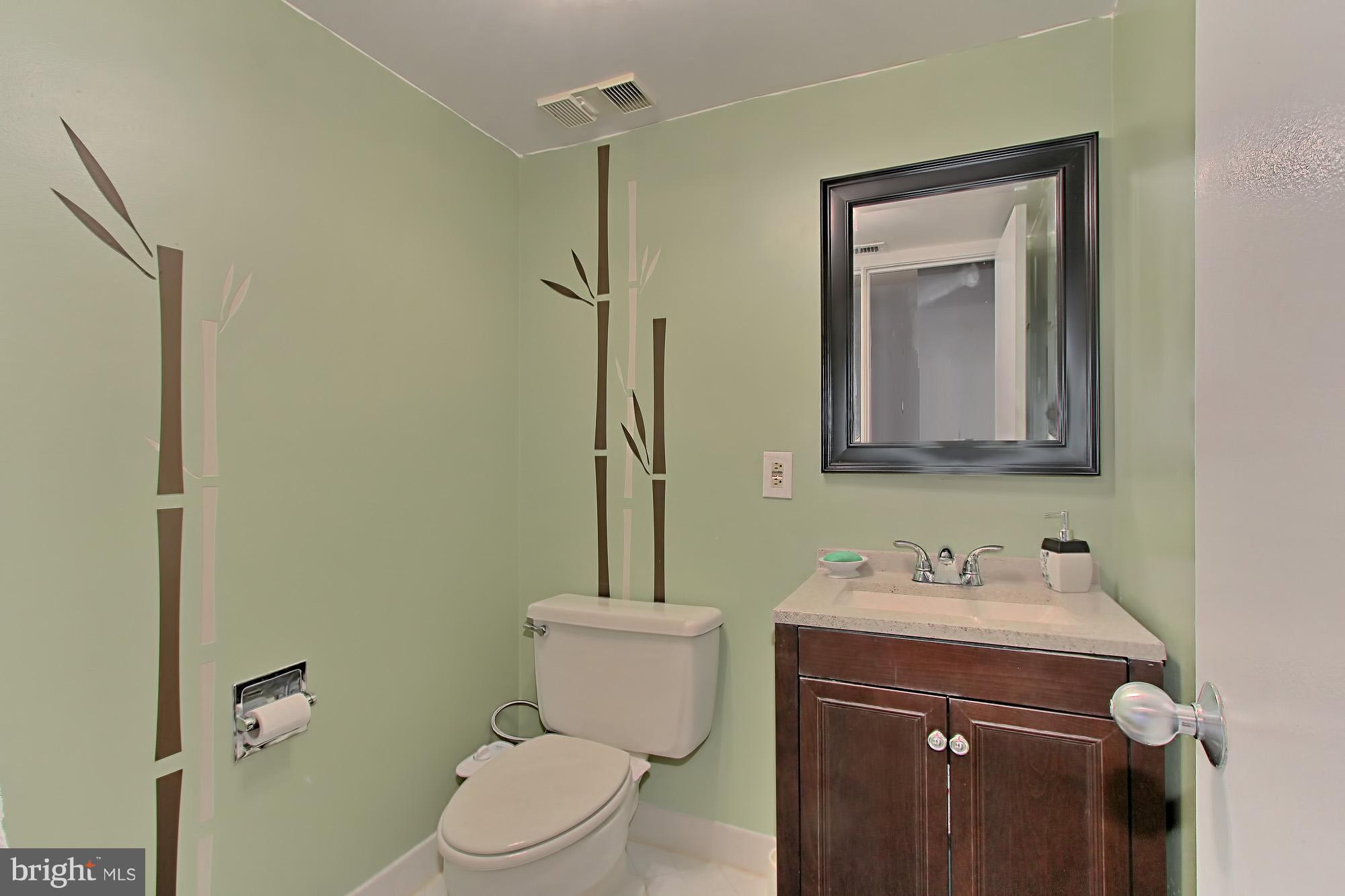 5501 Seminary Road, Unit 314S Falls Church, VA 22041 - Photo 17 of 30 a bathroom with a toilet sink and mirror