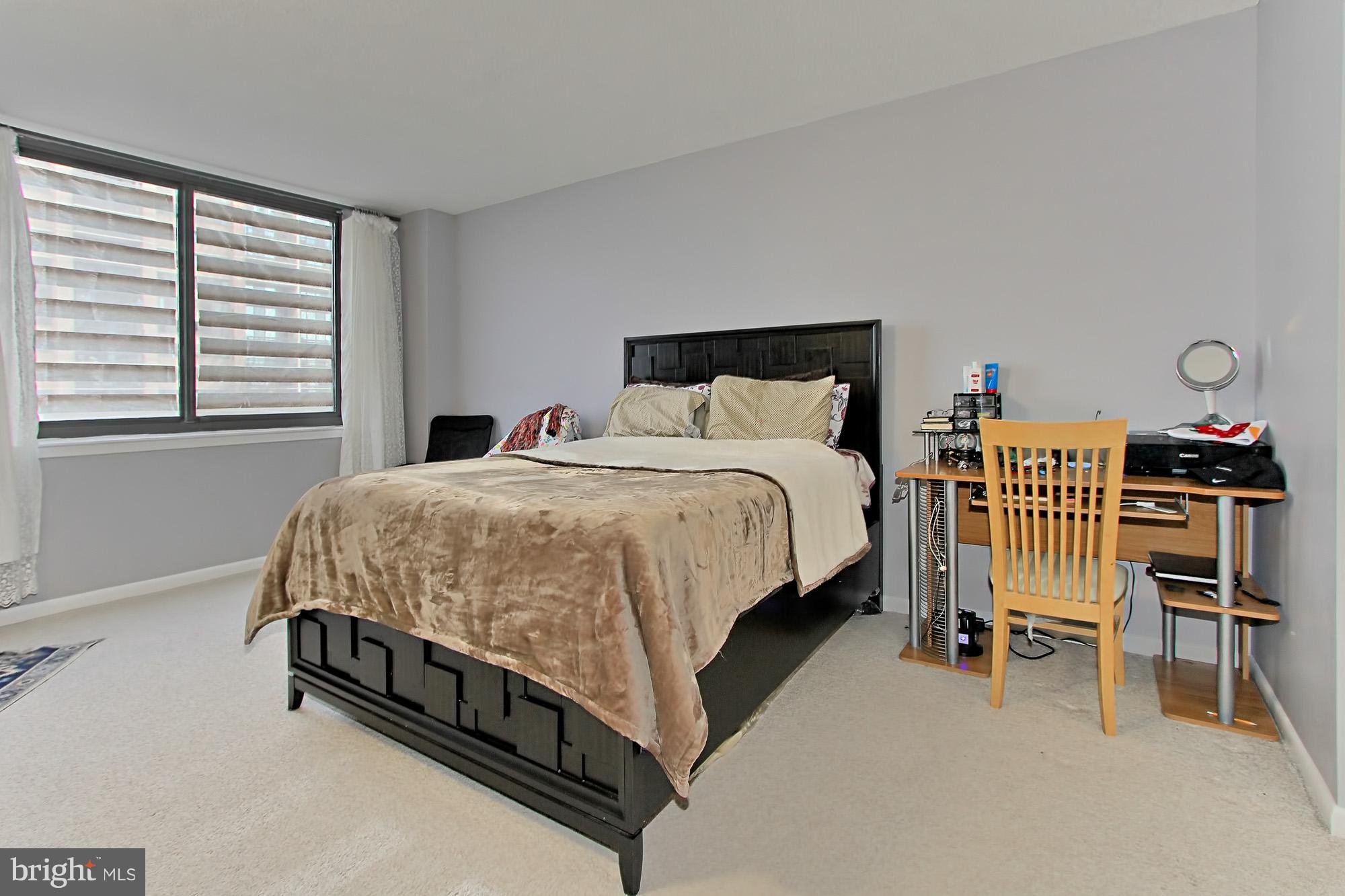 5501 Seminary Road, Unit 314S Falls Church, VA 22041 - Photo 18 of 30 a bedroom with a bed and a table in it