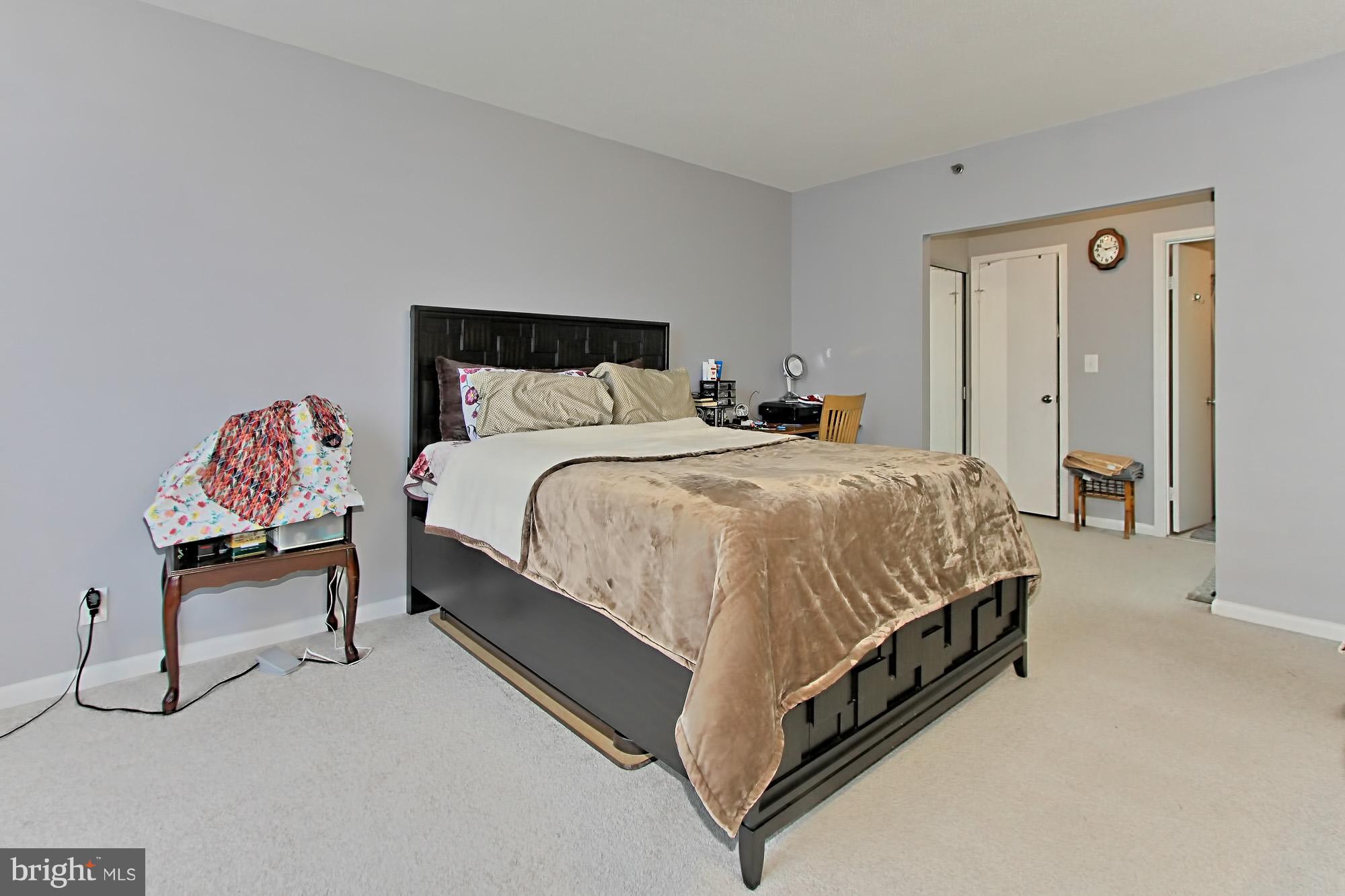 5501 Seminary Road, Unit 314S Falls Church, VA 22041 - Photo 19 of 30 a bedroom with a bed and a chair