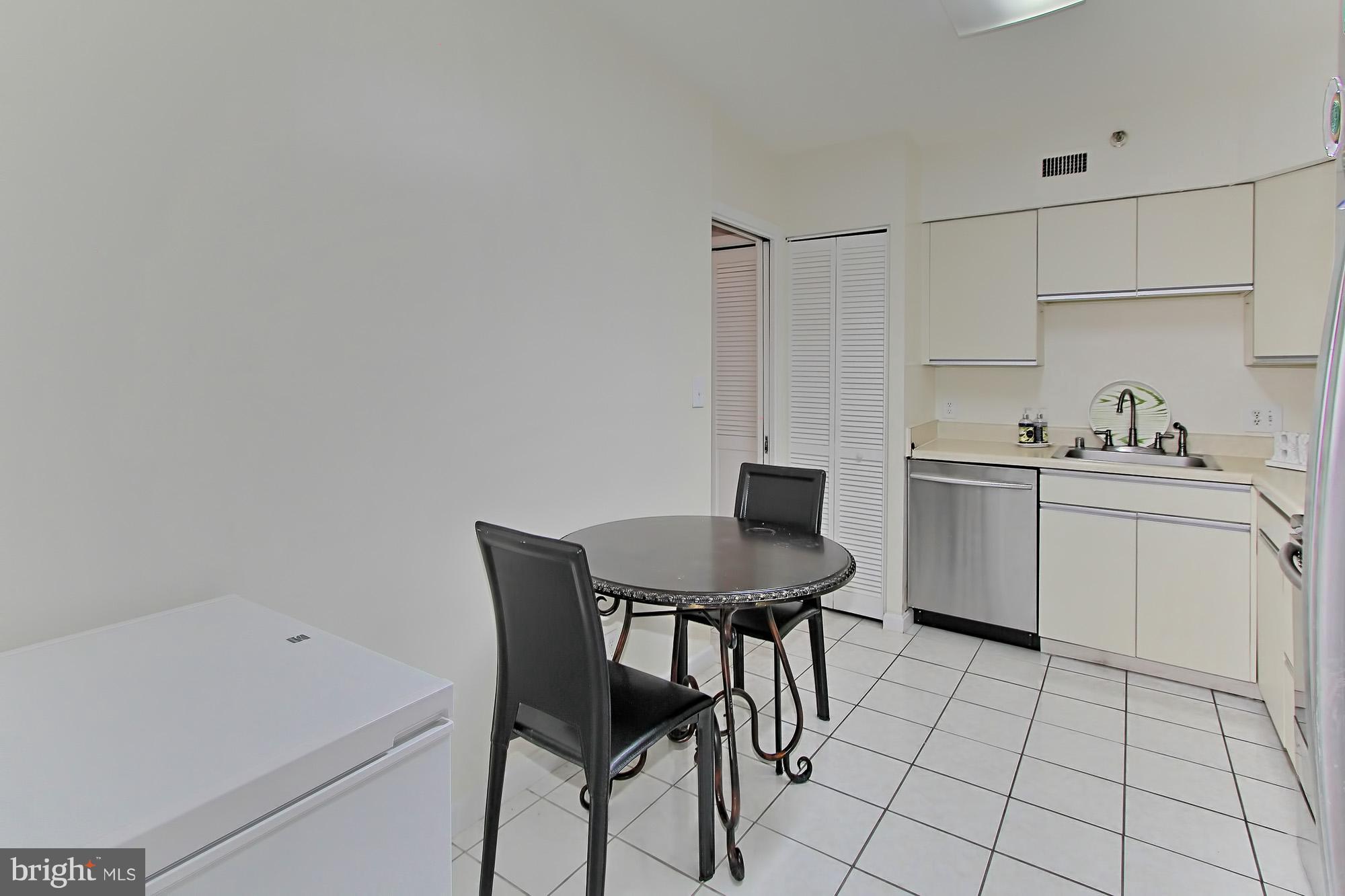 5501 Seminary Road, Unit 314S Falls Church, VA 22041 - Photo 5 of 30 a view of a kitchen area with furniture and wooden floor