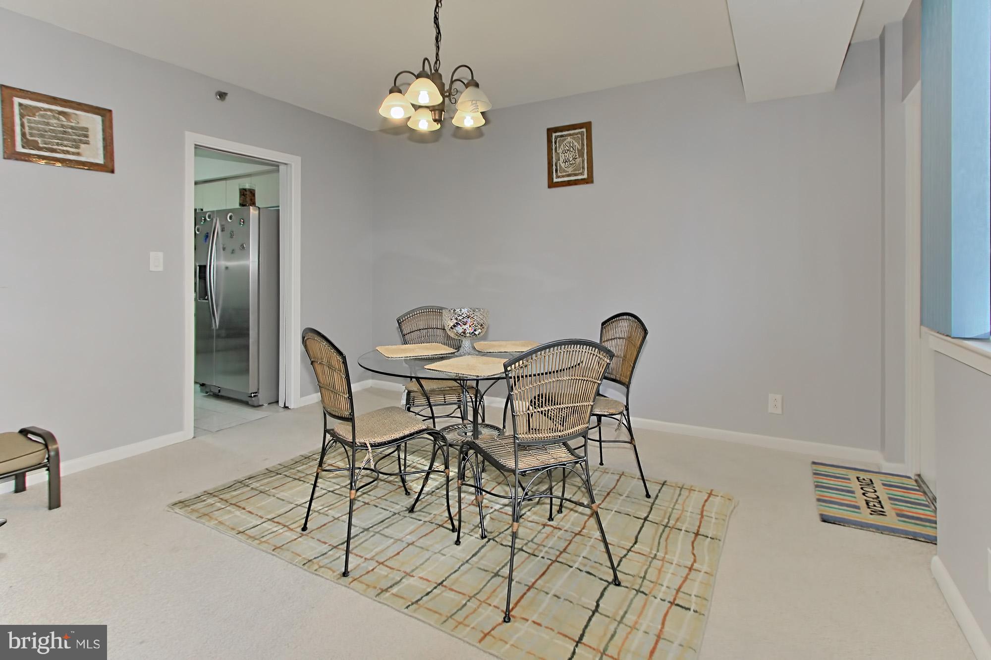 5501 Seminary Road, Unit 314S Falls Church, VA 22041 - Photo 6 of 30 a view of a dining room with furniture and chandelier