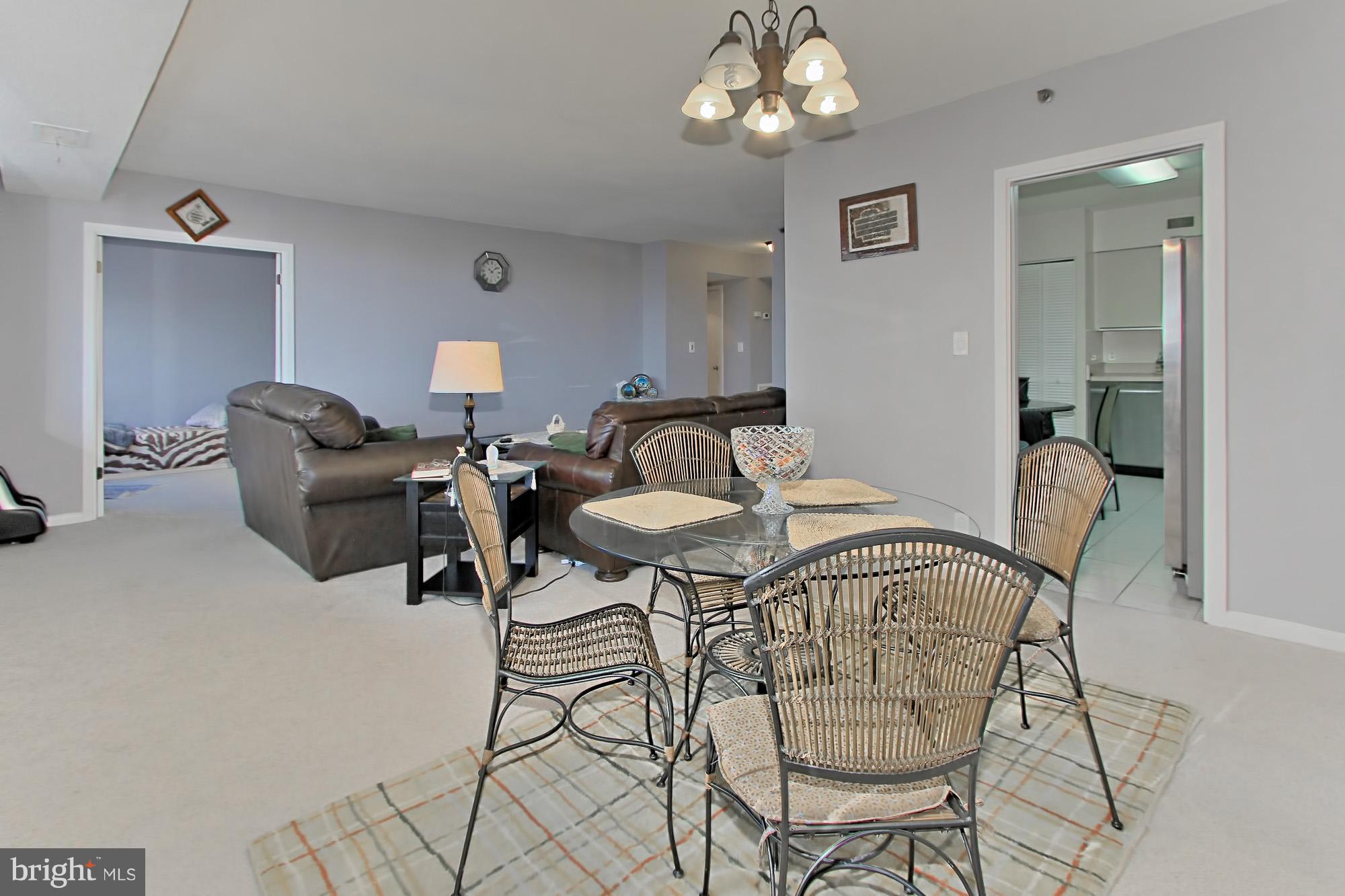 5501 Seminary Road, Unit 314S Falls Church, VA 22041 - Photo 8 of 30 a view of a dining room with furniture and chandelier