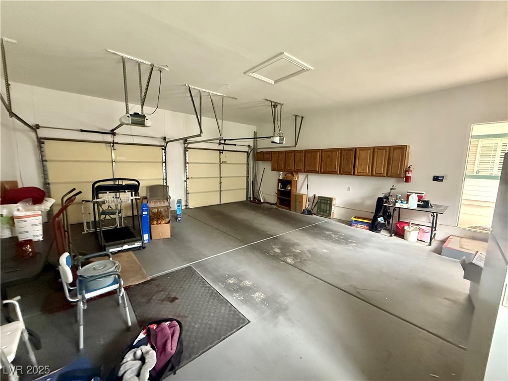10561 Rancho Destino Road Las Vegas, NV 89183 - Photo 8 of 29 Garage featuring a garage door opener