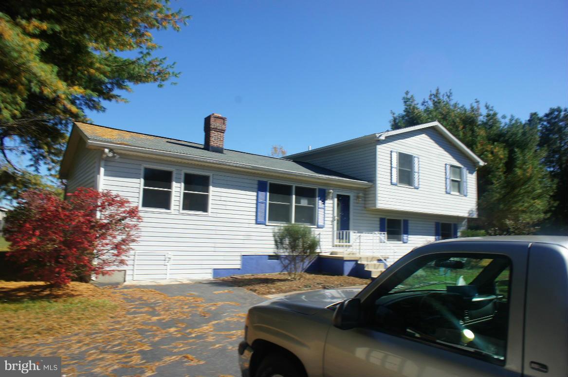 3042 Soper Road Huntingtown, MD 20639 - Photo 1 of 15 a view of a car parked in front of a house