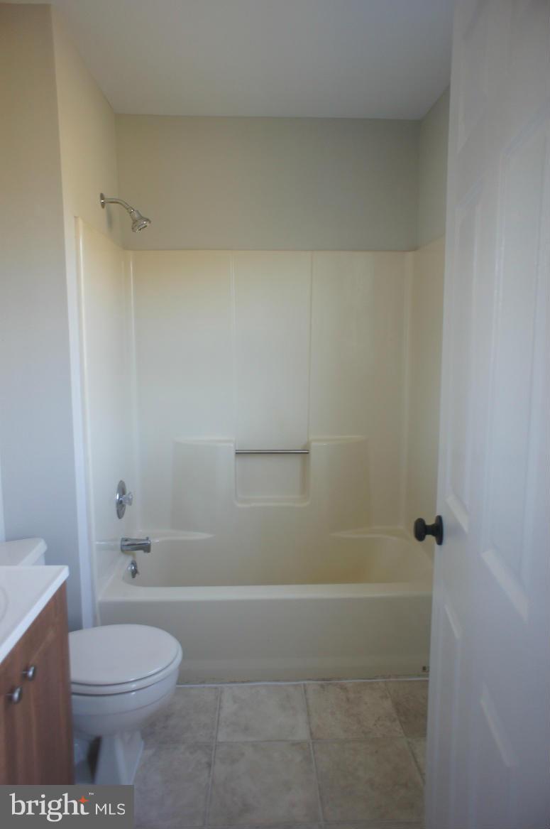 3042 Soper Road Huntingtown, MD 20639 - Photo 13 of 15 a bathroom with a toilet and shower
