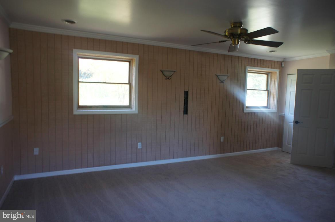 3042 Soper Road Huntingtown, MD 20639 - Photo 5 of 15 a view of an empty room with a window