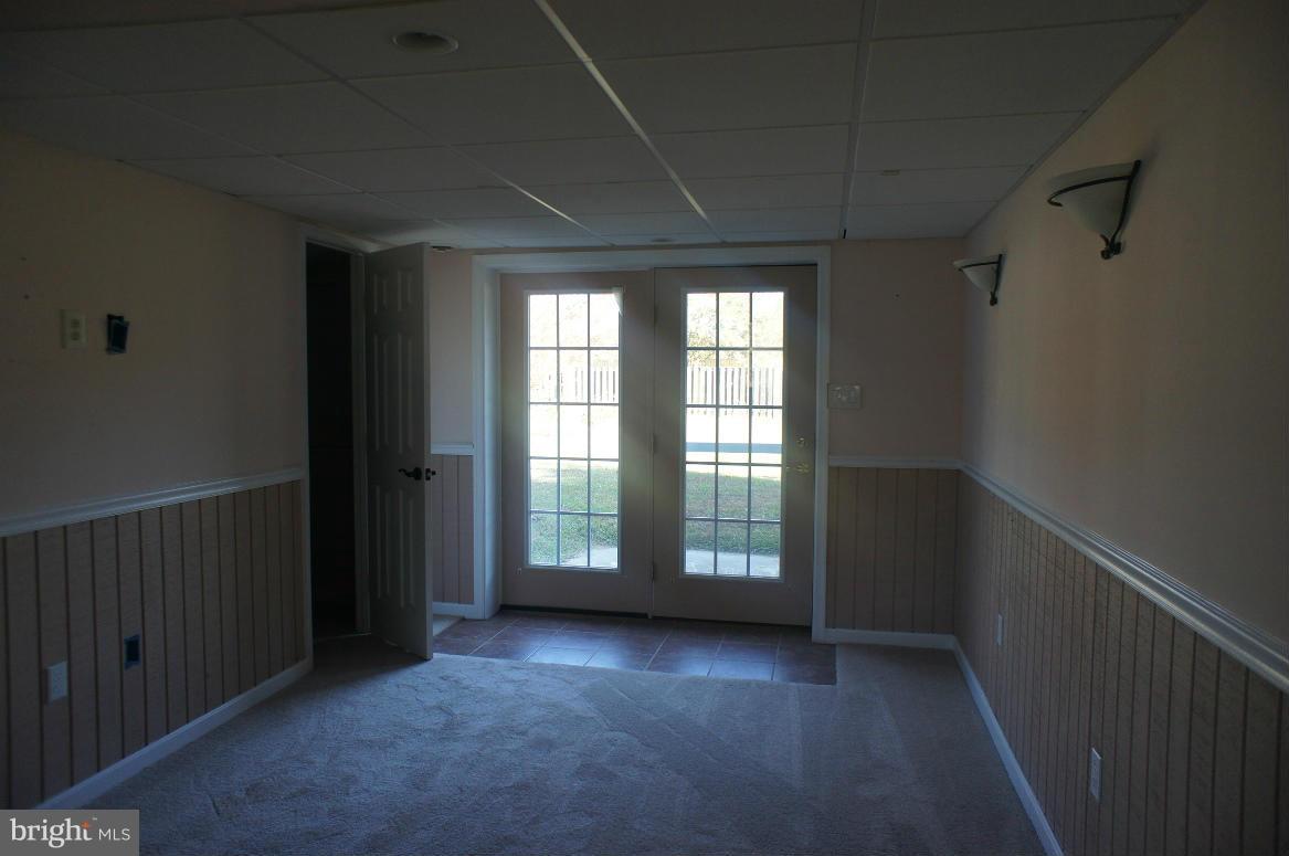 3042 Soper Road Huntingtown, MD 20639 - Photo 6 of 15 an empty room with windows