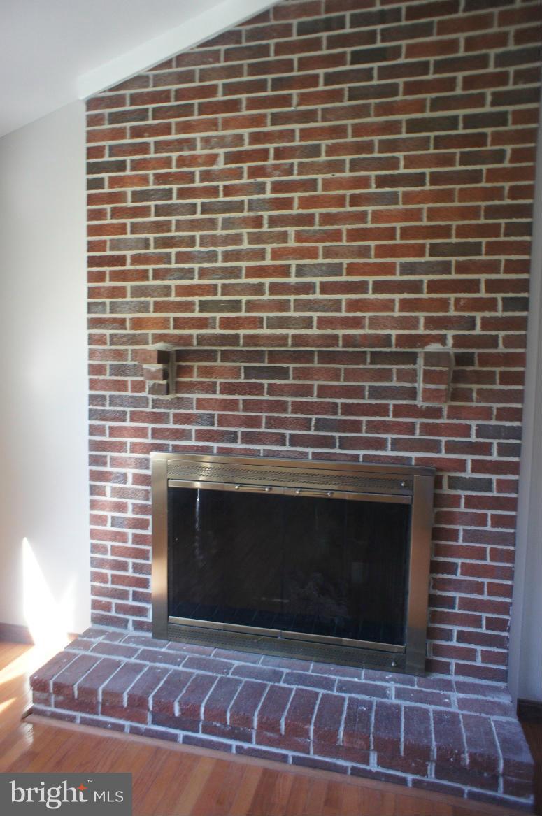3042 Soper Road Huntingtown, MD 20639 - Photo 9 of 15 a brick oven with fireplace