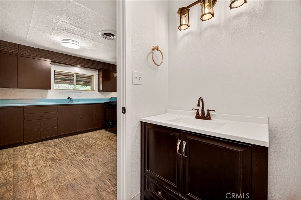 351 2nd Street Hamilton City, CA 95951 - Photo 17 of 52 a kitchen with a sink and a mirror