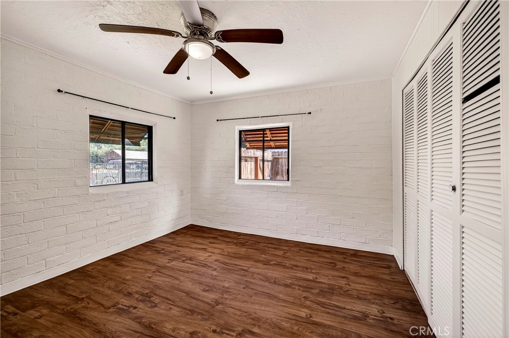 351 2nd Street Hamilton City, CA 95951 - Photo 23 of 52 a view of empty room with wooden floor and fan