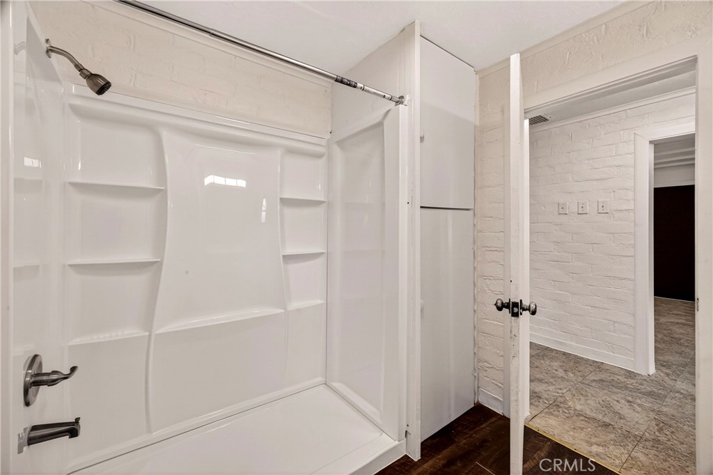 351 2nd Street Hamilton City, CA 95951 - Photo 27 of 52 a bathroom with a shower and a glass door