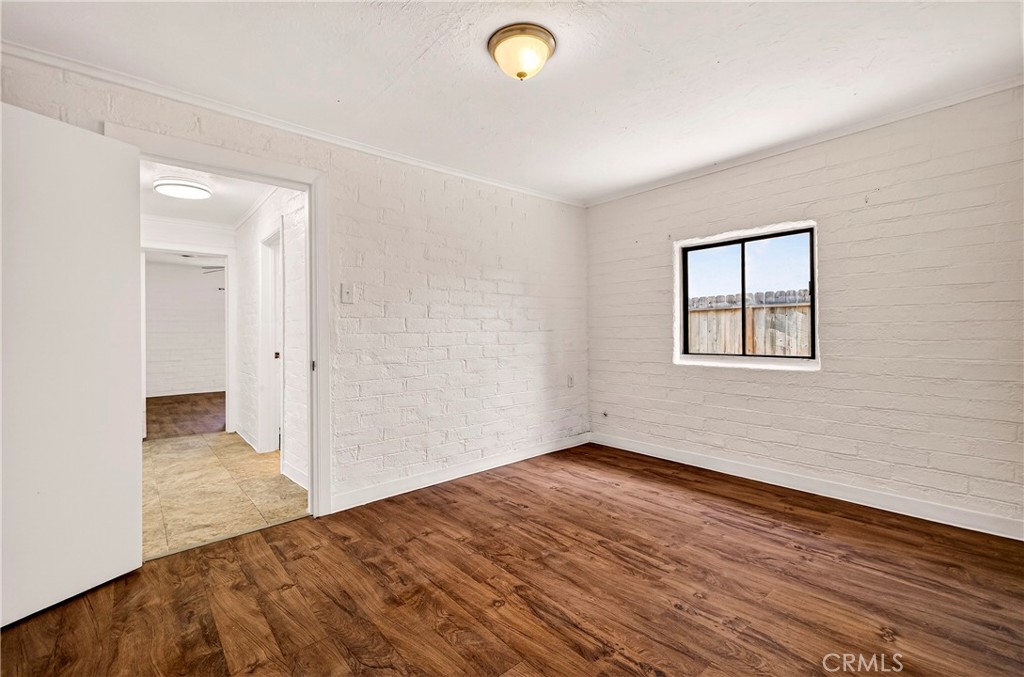 351 2nd Street Hamilton City, CA 95951 - Photo 30 of 52 an empty room with wooden floor and windows