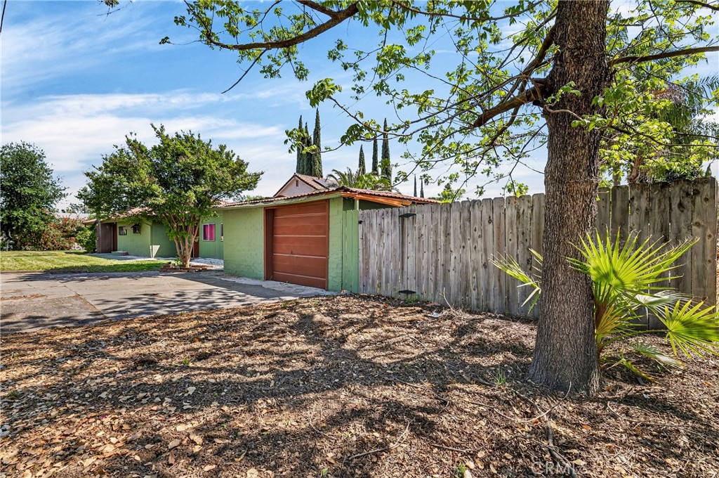 351 2nd Street Hamilton City, CA 95951 - Photo 7 of 52 a view of a backyard with plants and large trees