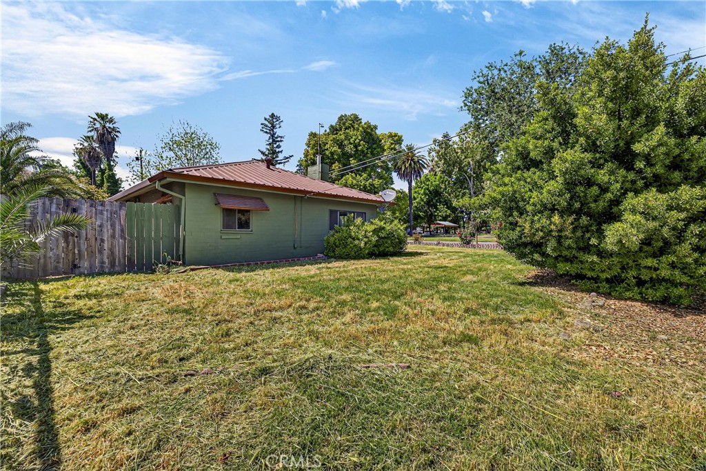 351 2nd Street Hamilton City, CA 95951 - Photo 8 of 52 a yellow house with tree in front of it