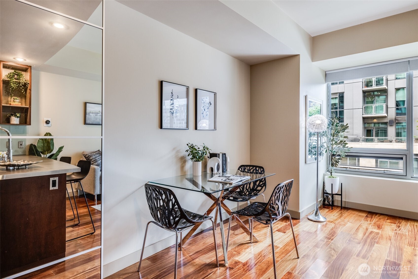 900 Lenora Street, Unit W402 Seattle, WA 98121 - Photo 13 of 39 a view of a dining room with furniture and a kitchen