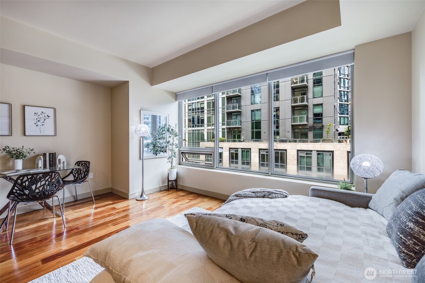 900 Lenora Street, Unit W402 Seattle, WA 98121 - Photo 17 of 39 a living room with furniture and a large window