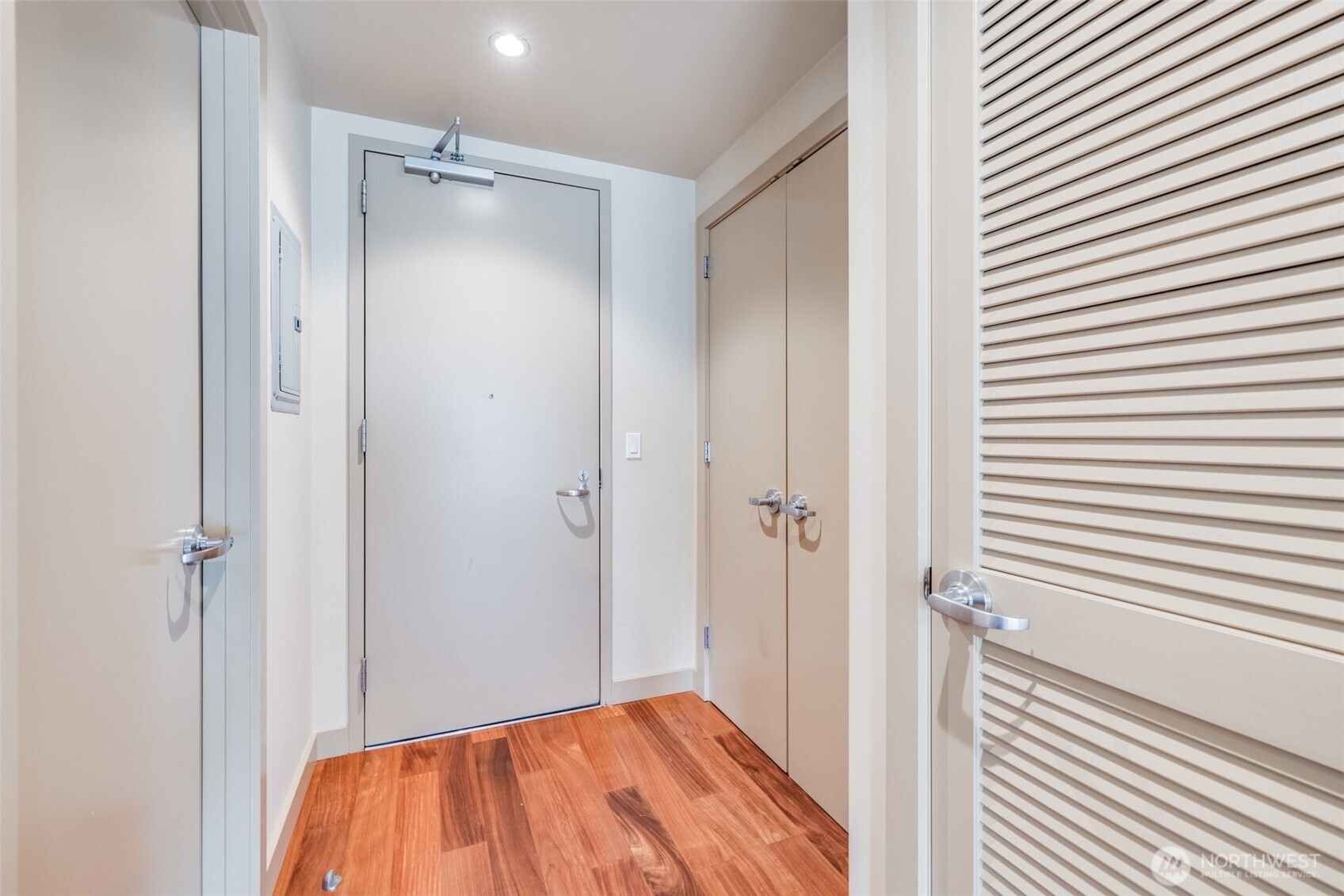900 Lenora Street, Unit W402 Seattle, WA 98121 - Photo 21 of 39 a view of a bathroom from a hallway