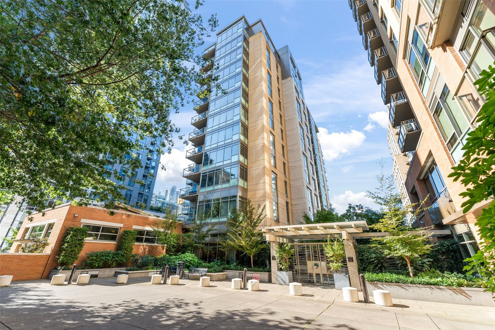 900 Lenora Street, Unit W402 Seattle, WA 98121 - Photo 30 of 39 a view of a building with a tree