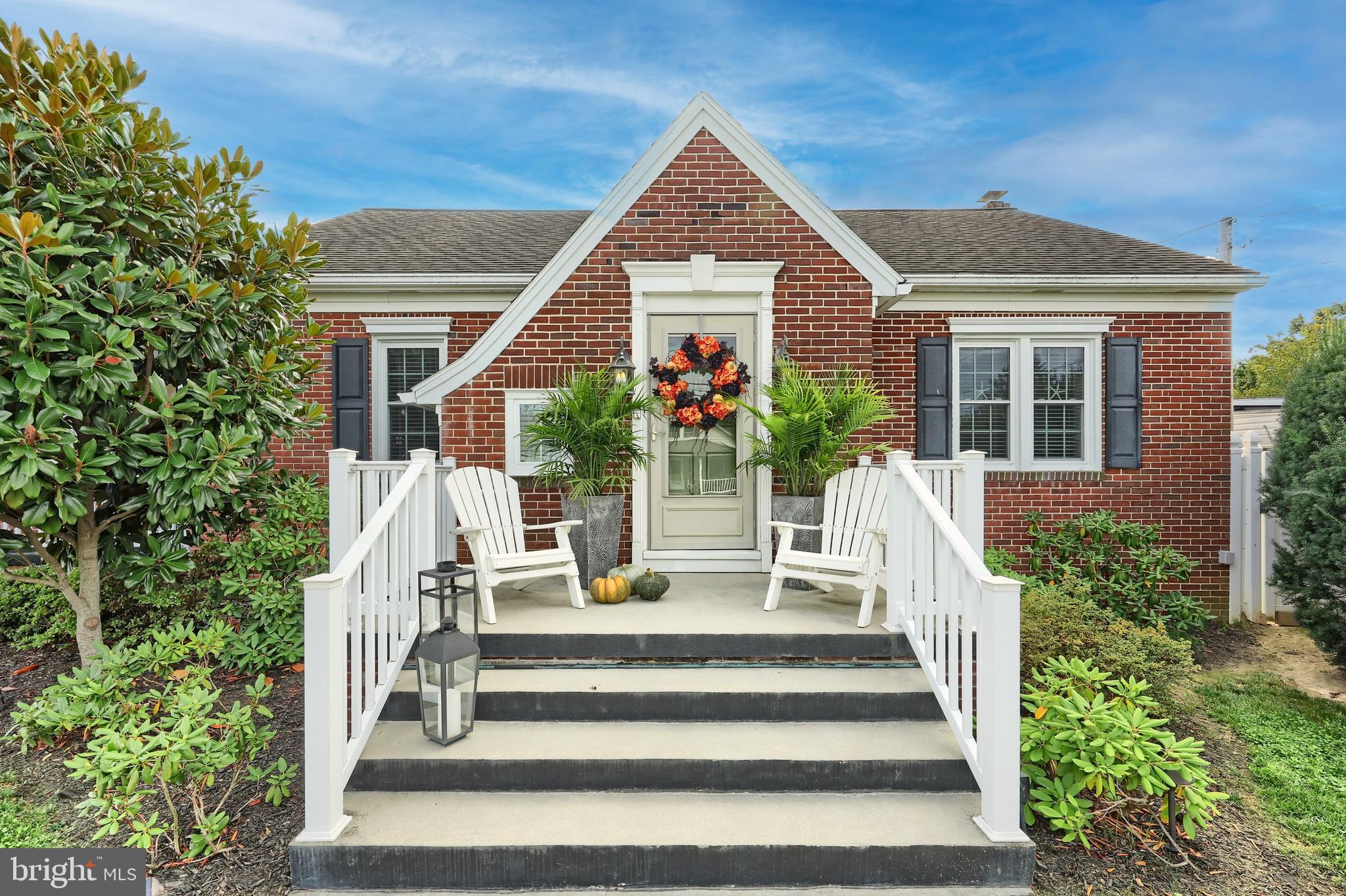 372 Maple Avenue Hanover, PA 17331 - Photo 11 of 87 a front view of a house with potted plants