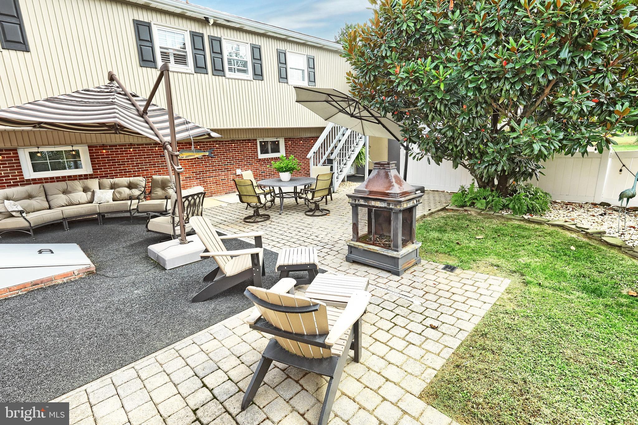 372 Maple Avenue Hanover, PA 17331 - Photo 17 of 87 a view of a patio with couches table and chairs and potted plants