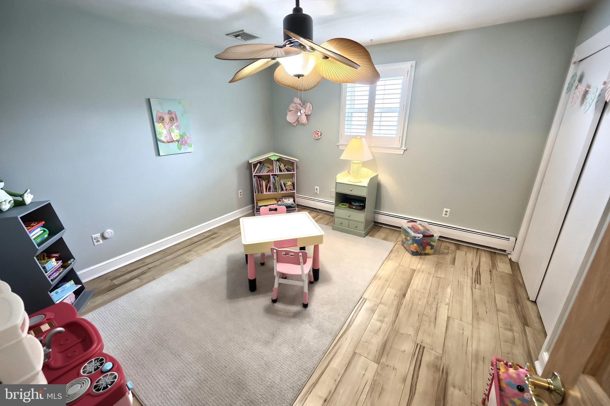 372 Maple Avenue Hanover, PA 17331 - Photo 34 of 87 a bedroom with a bed and a chandelier