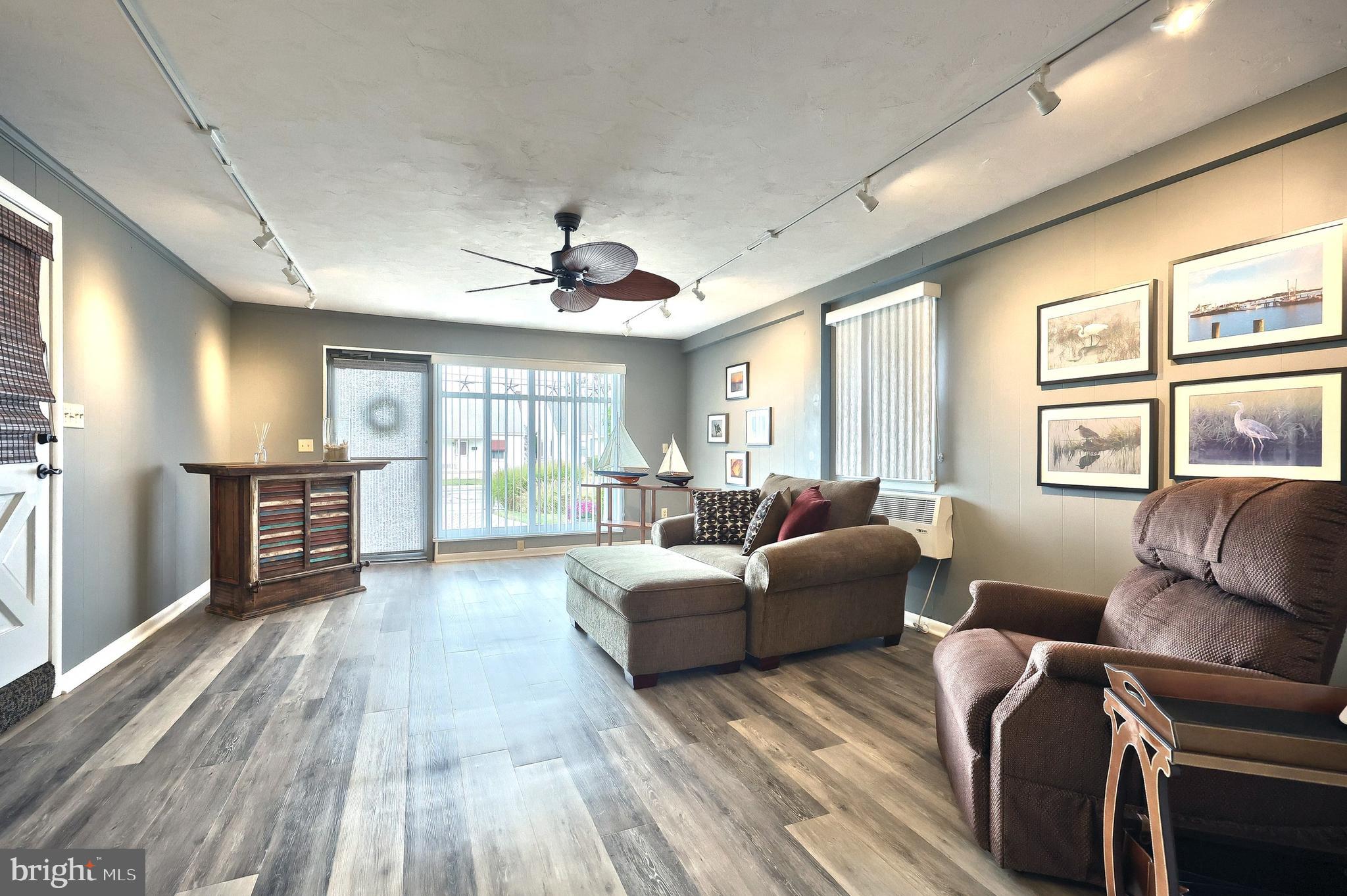372 Maple Avenue Hanover, PA 17331 - Photo 56 of 87 a living room with furniture large windows and wooden floor