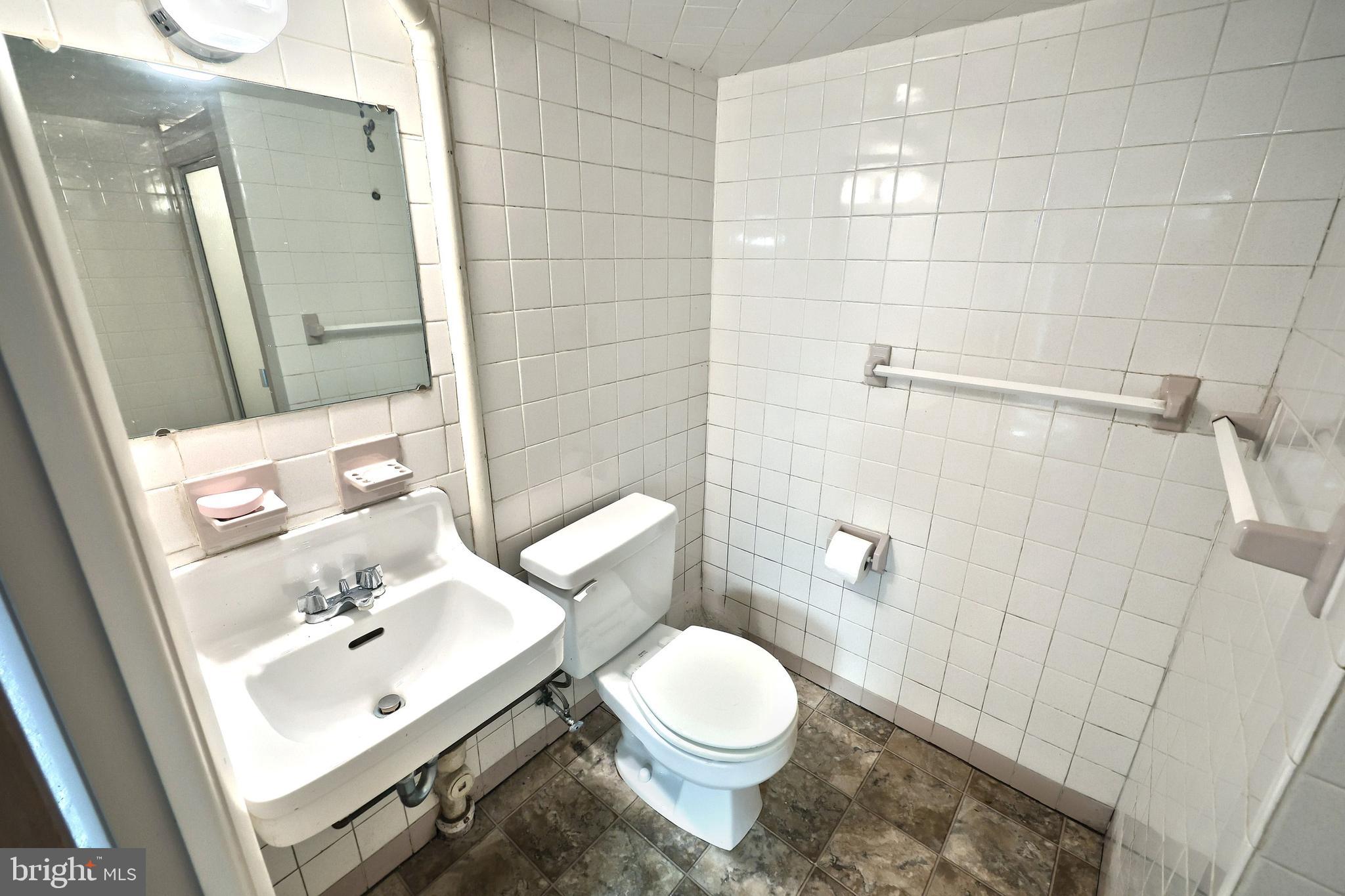 372 Maple Avenue Hanover, PA 17331 - Photo 73 of 87 a white toilet sitting next to a bathroom sink