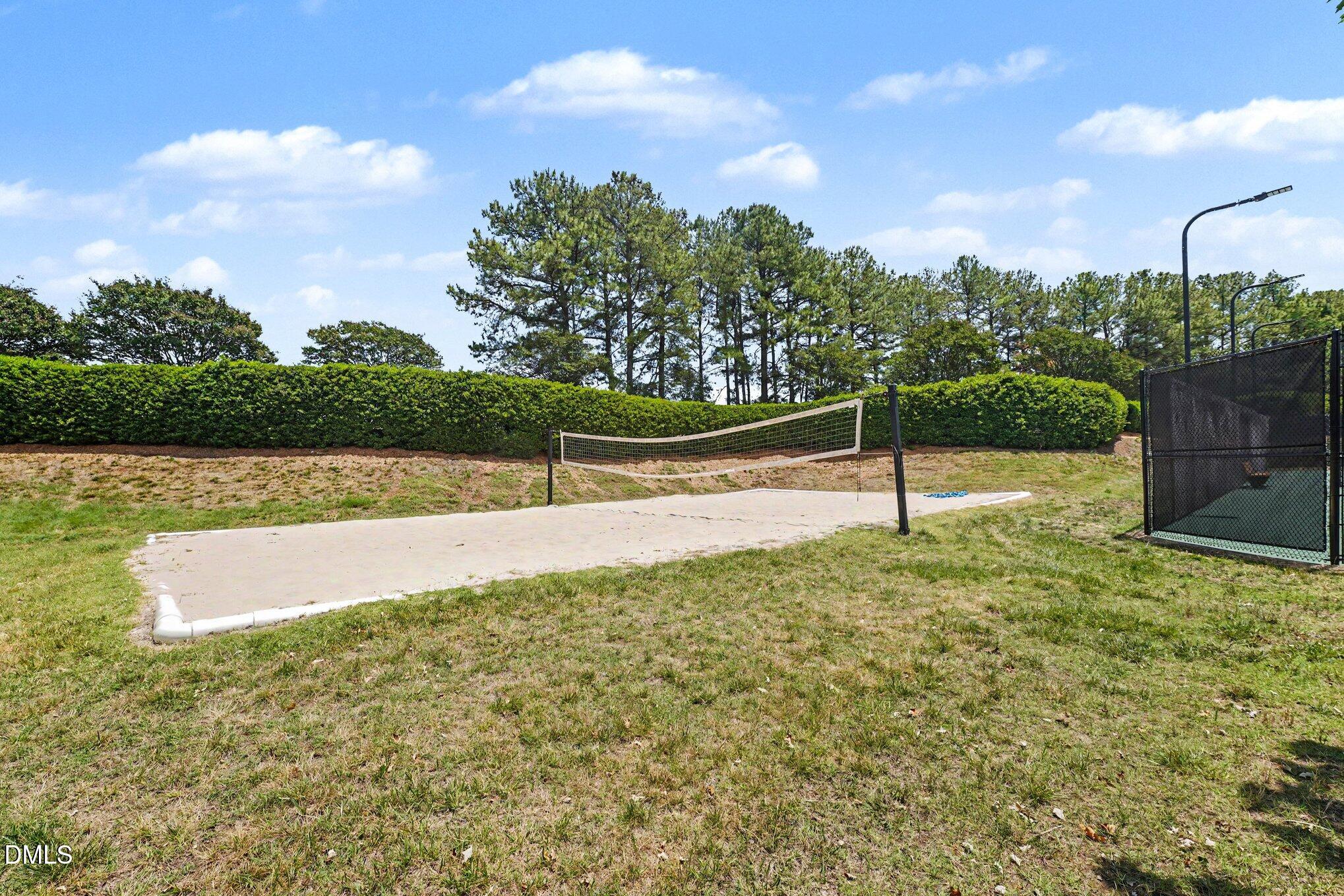 1130 Renewal Place, Unit 106 Raleigh, NC 27603 - Photo 29 of 34 a view of yard with swimming pool and trees in the background